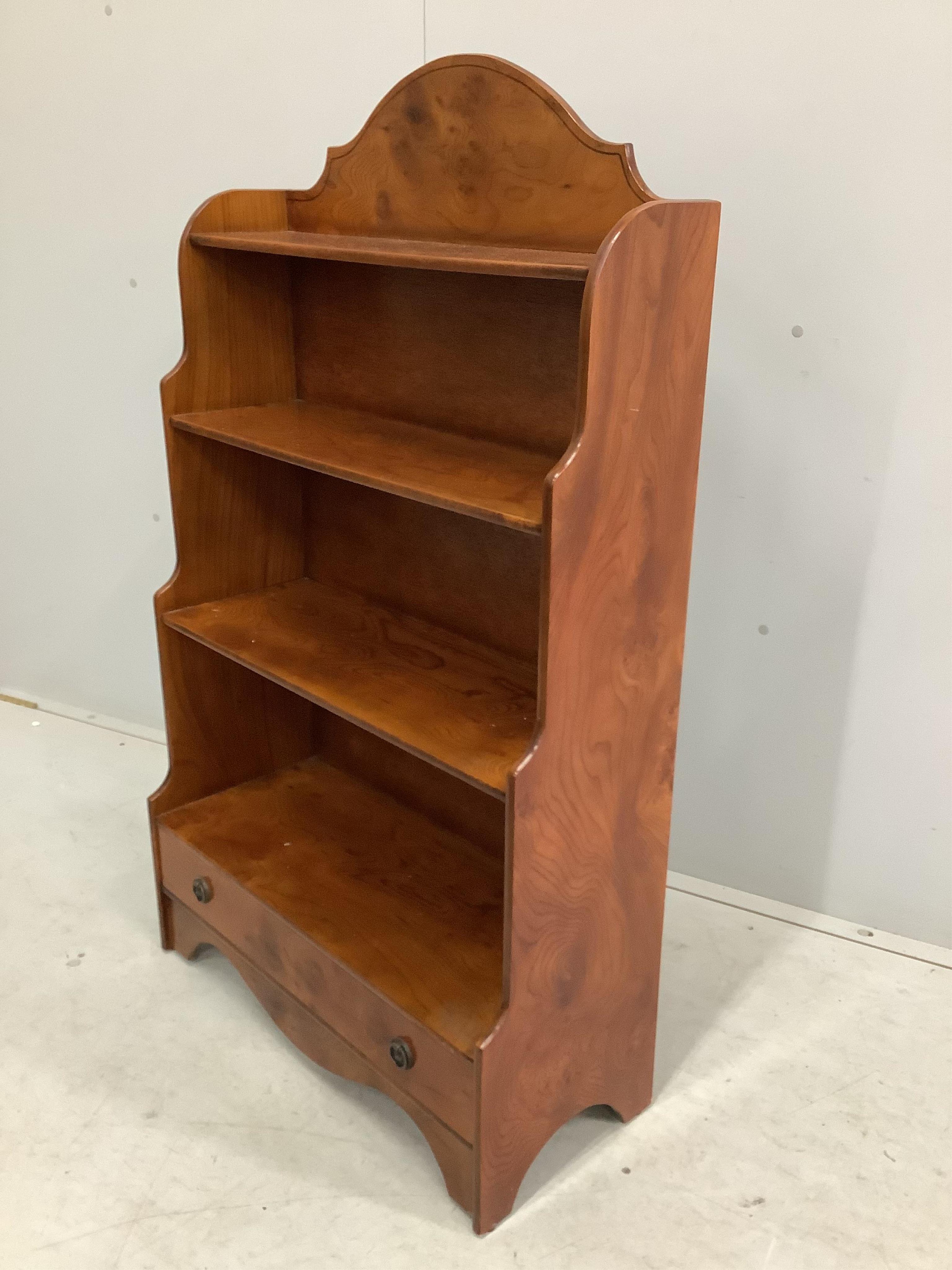 A reproduction elm graduated open bookcase, width 70cm, height 121cm. Condition - fair to good